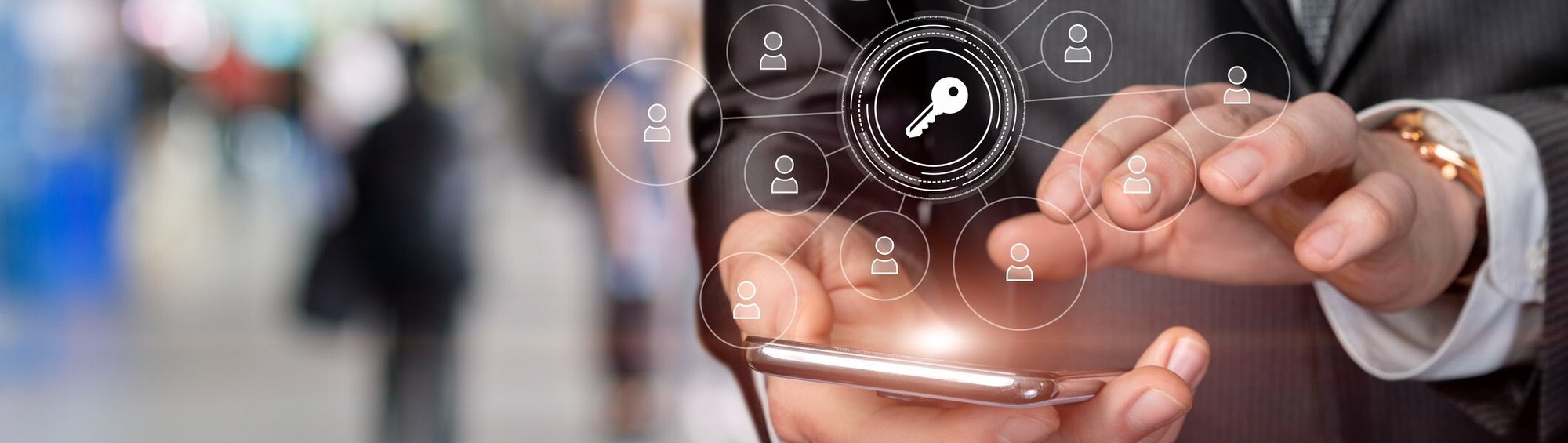 Businessman on a mobile phone with user and key icons floating above