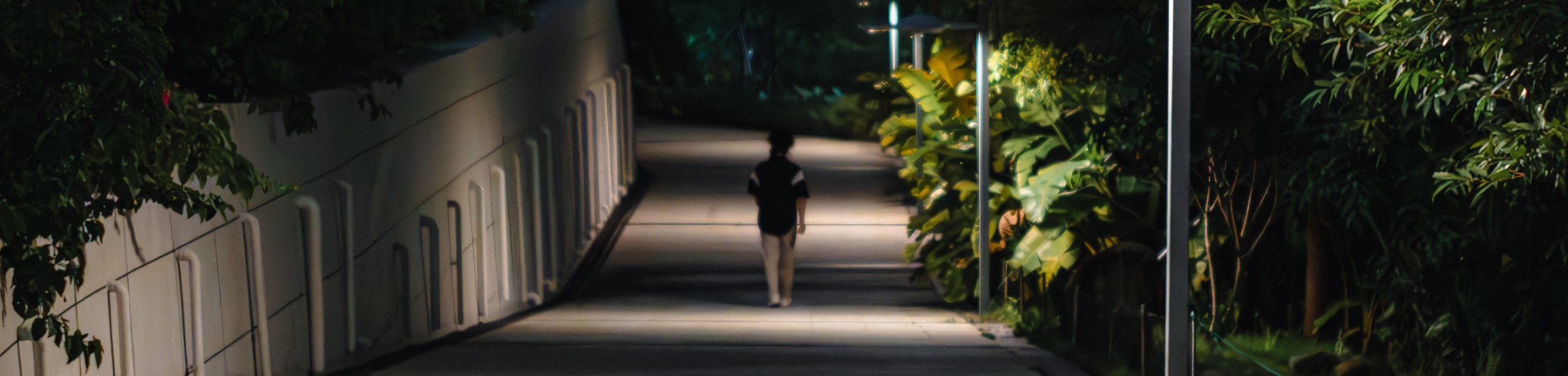 College student walking alone at night