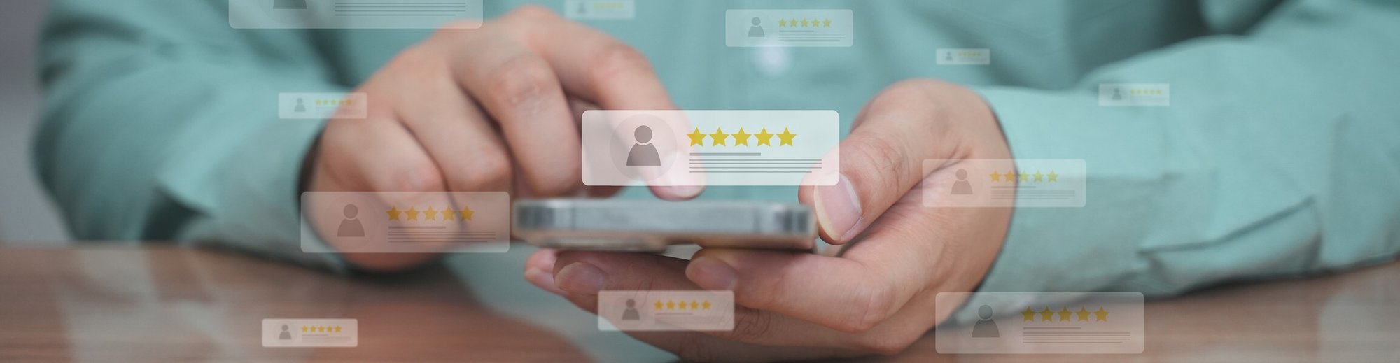Person using a smartphone with floating five-star review icons, representing online ratings and feedback.