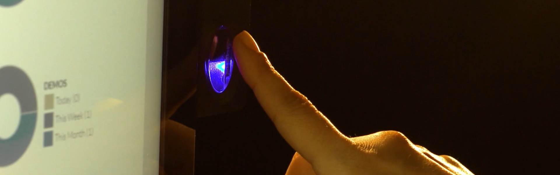 Person placing finger on KeyTrak Edge fingerprint reader