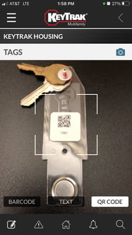 Phone scanning QR code on key tag