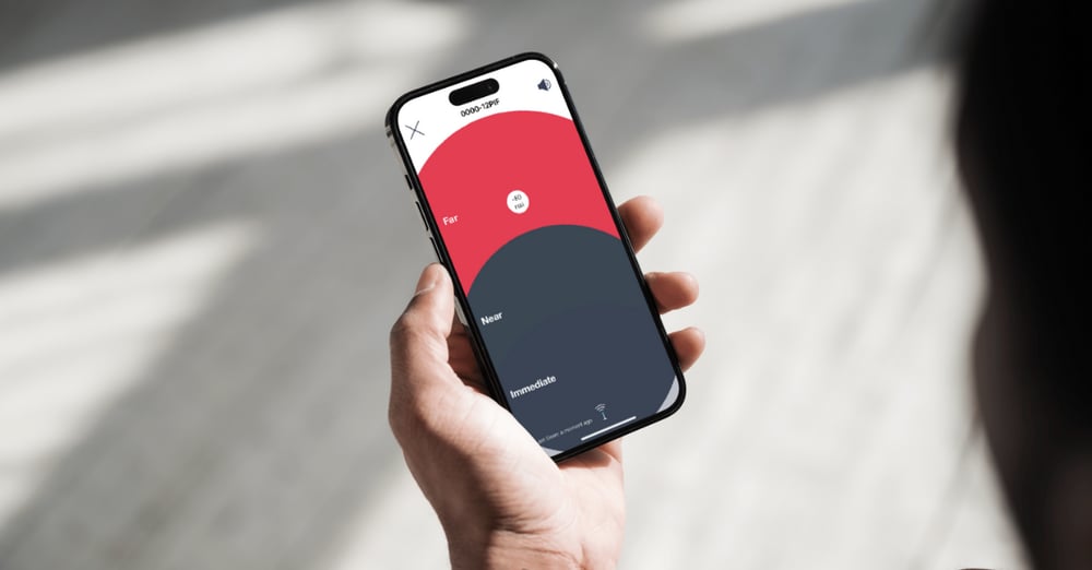 Person pinpointing a key or asset on their phone