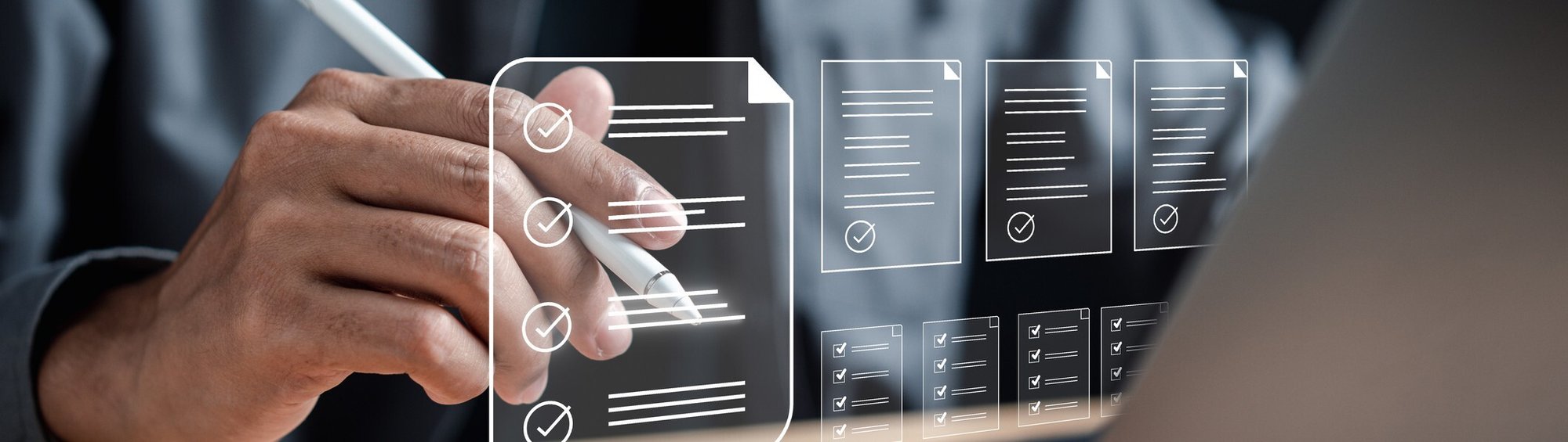 A person using a stylus to complete a glowing holographic digital checklist hovering above a laptop computer A person using a stylus to complete a glowing holographic digital checklist hovering above a laptop computer