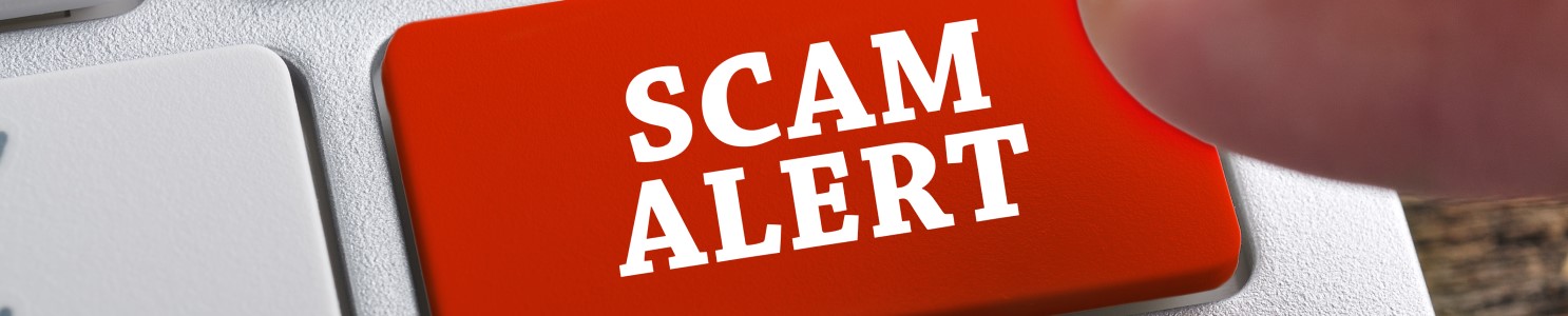 Scam alert on keyboard [583822594] banner